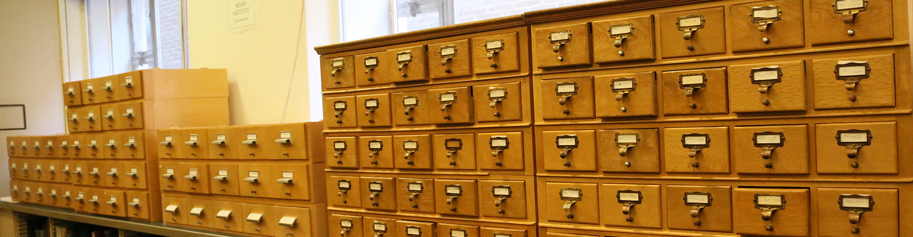 Rows of small wooden drawers containing the card catalogue
