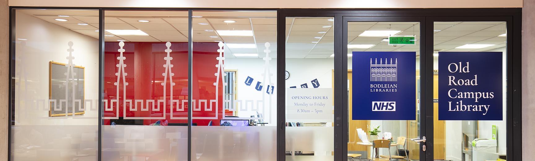 A glass wall and door, with the title Knowledge Centre written on the right pane