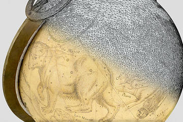 A globe bearing an old constellation diagram; half of the globe is a matrix of grey points